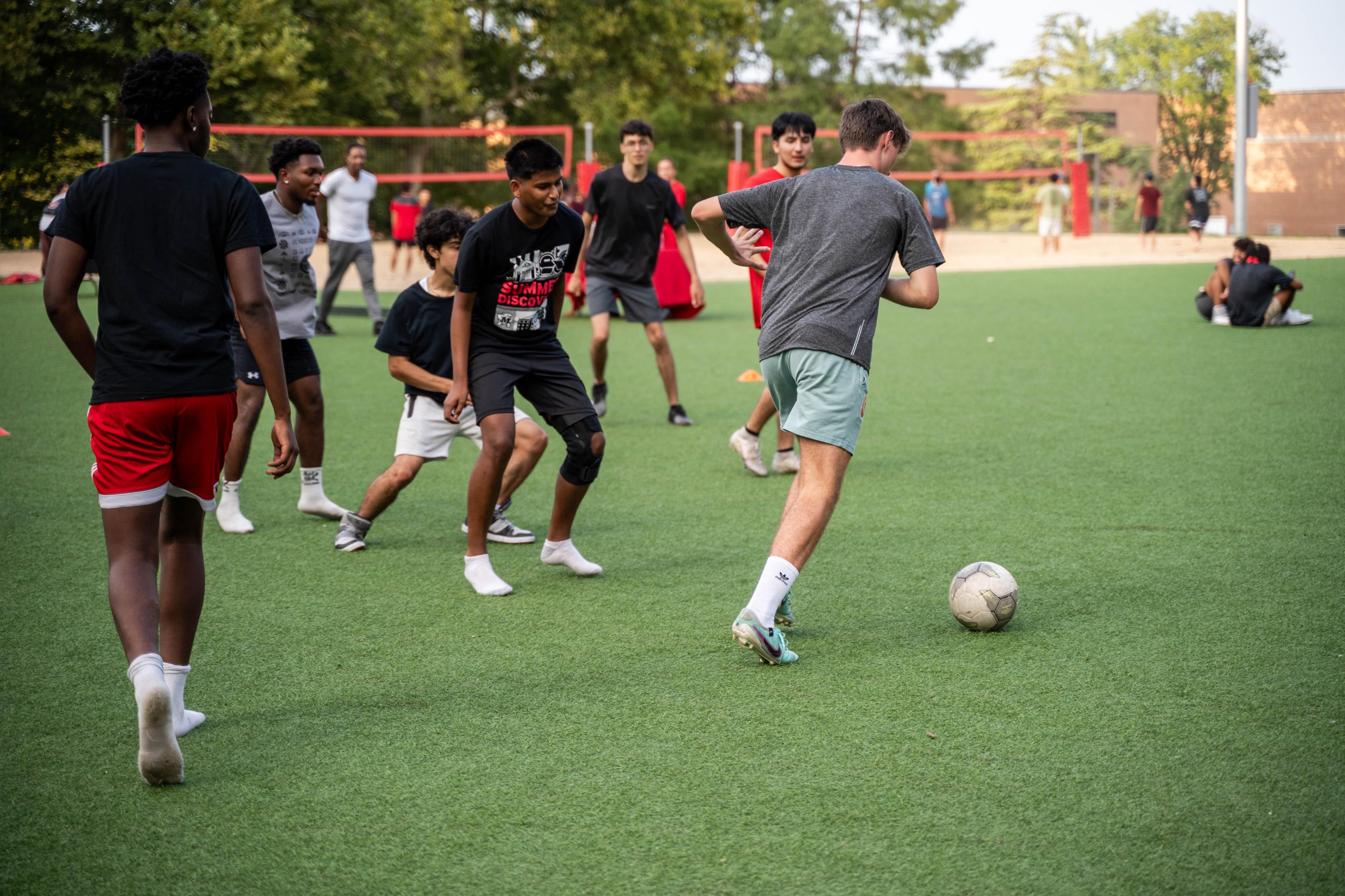 men playing soccer on la plata beach